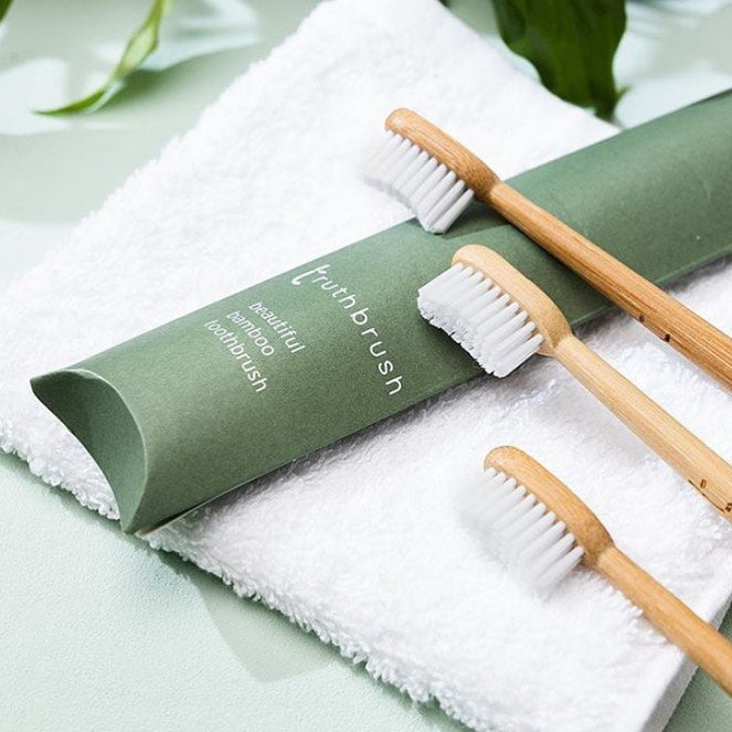 Truthbrush bamboo toothbrushes on flannel