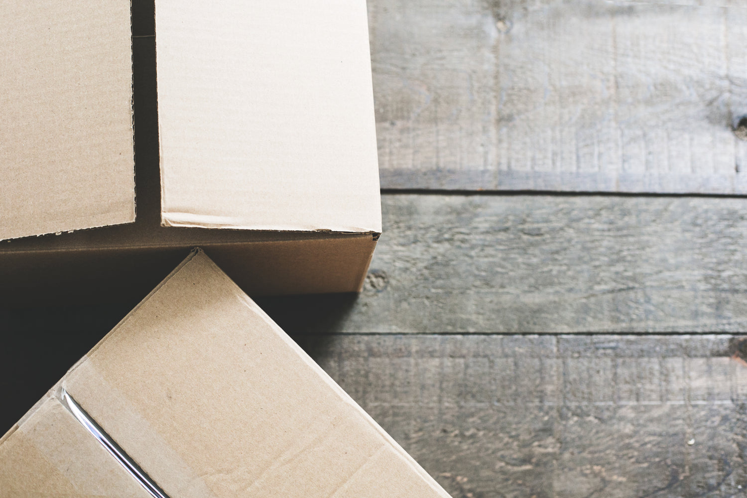 Eco friendly cardboard packaging used for all deliveries at on wooden table top
