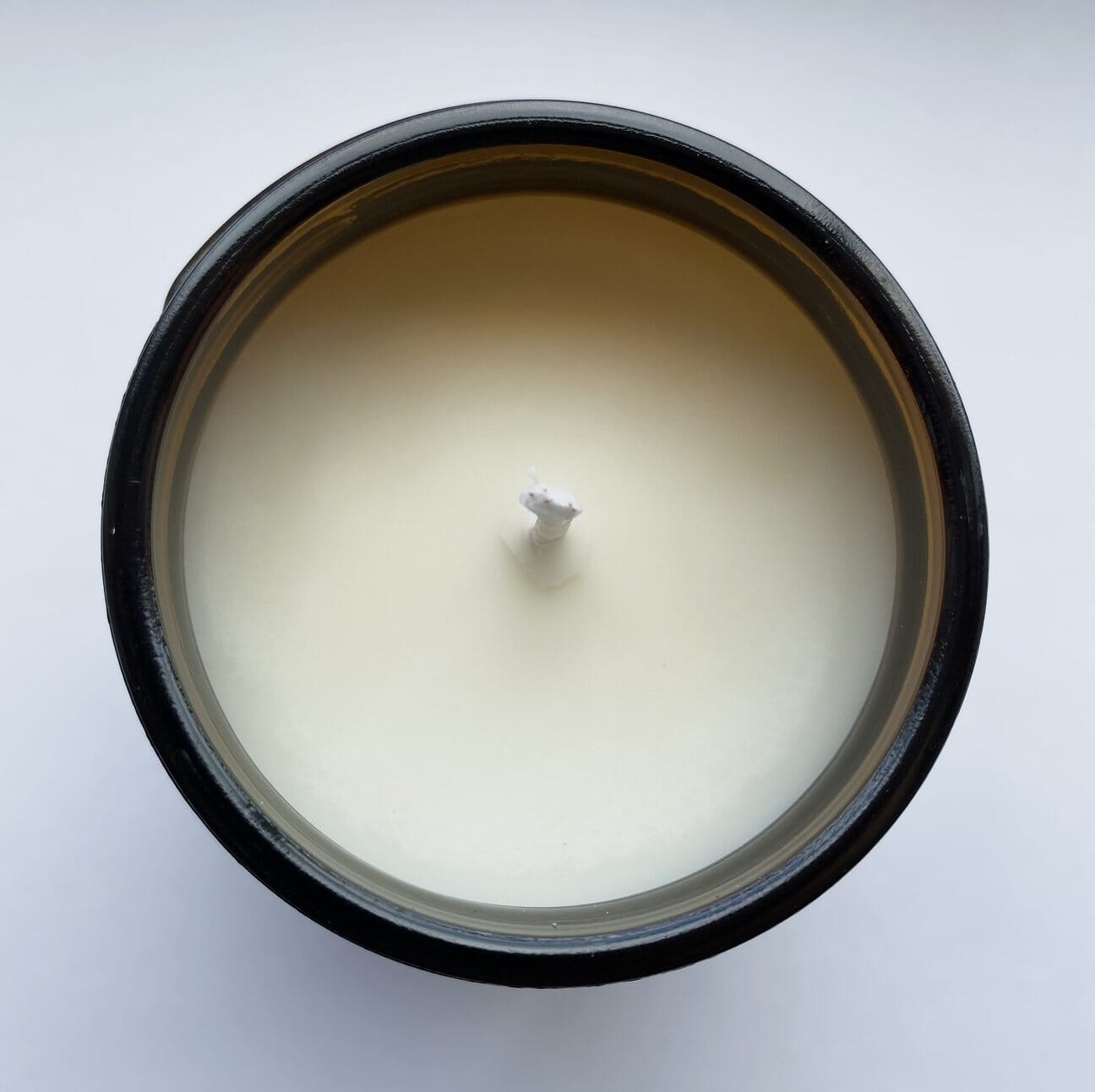 Amber & Musk Soy Wax Candle looking down at the wax and wick.