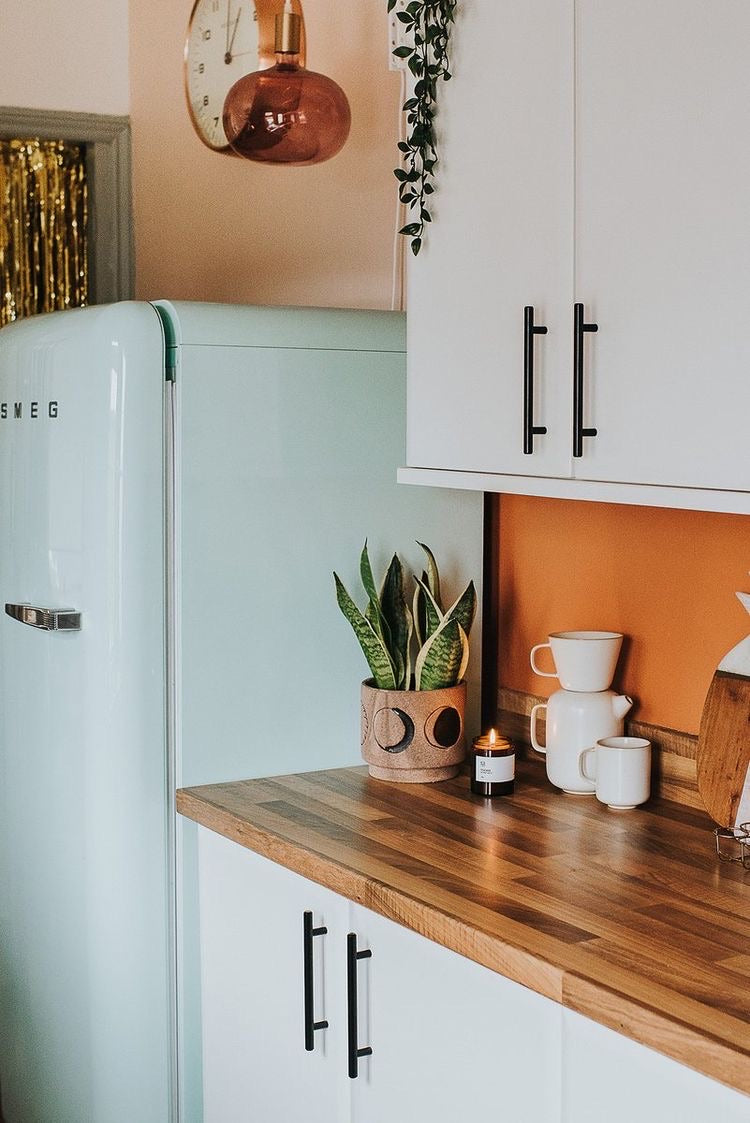 Toscana Soy Wax Candle on kitchen worktop near smeg fridge and plant (6126213660830)