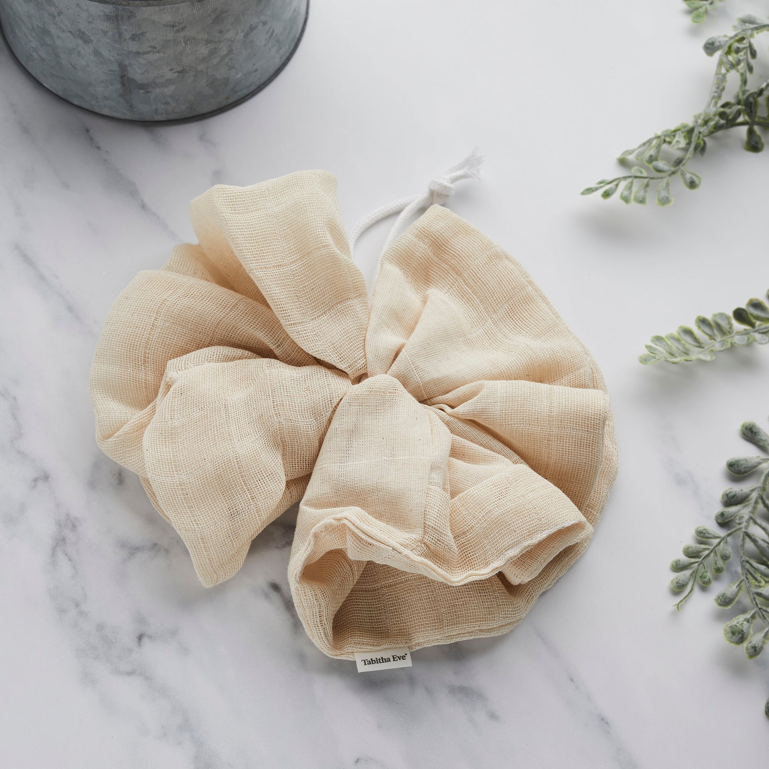 Bath pouf on marble vanity counter top