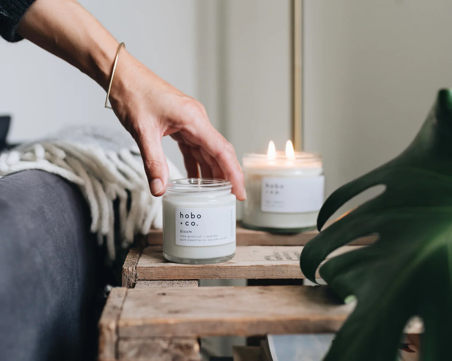 Hobo + co. soy wax candle sat on wooden table